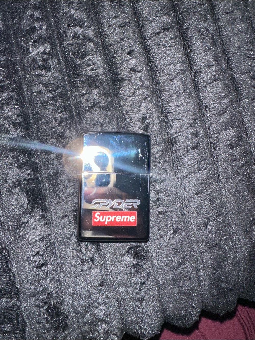 Supreme Silver Metal Lighter with Black Spider Graphic and Red Accent